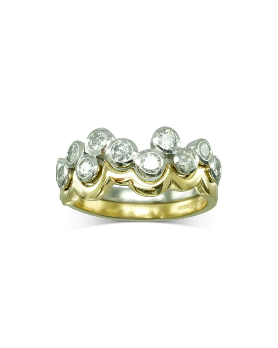 Gold and white gold wedding band with round diamonds in a bubble design.