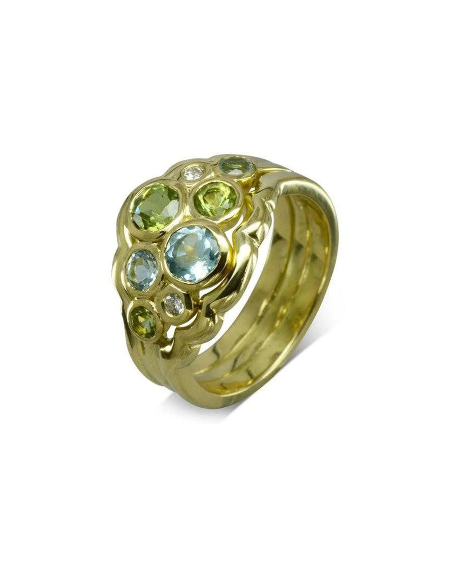 Gold wedding band with water bubble shaped peridot, aquamarine, and diamond gemstones.