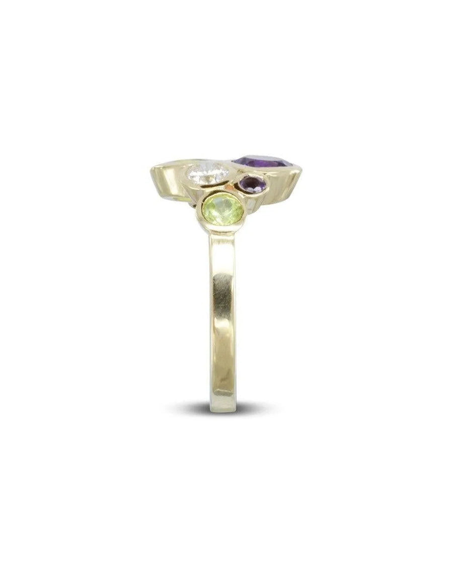 9ct yellow gold ring with white, green, and purple gemstones.