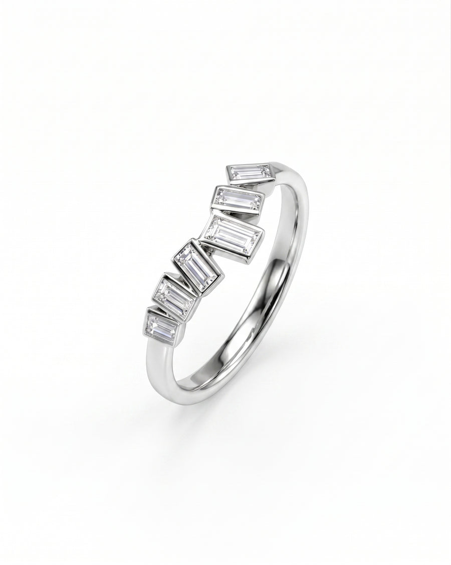Silver curved ring with baguette diamonds.