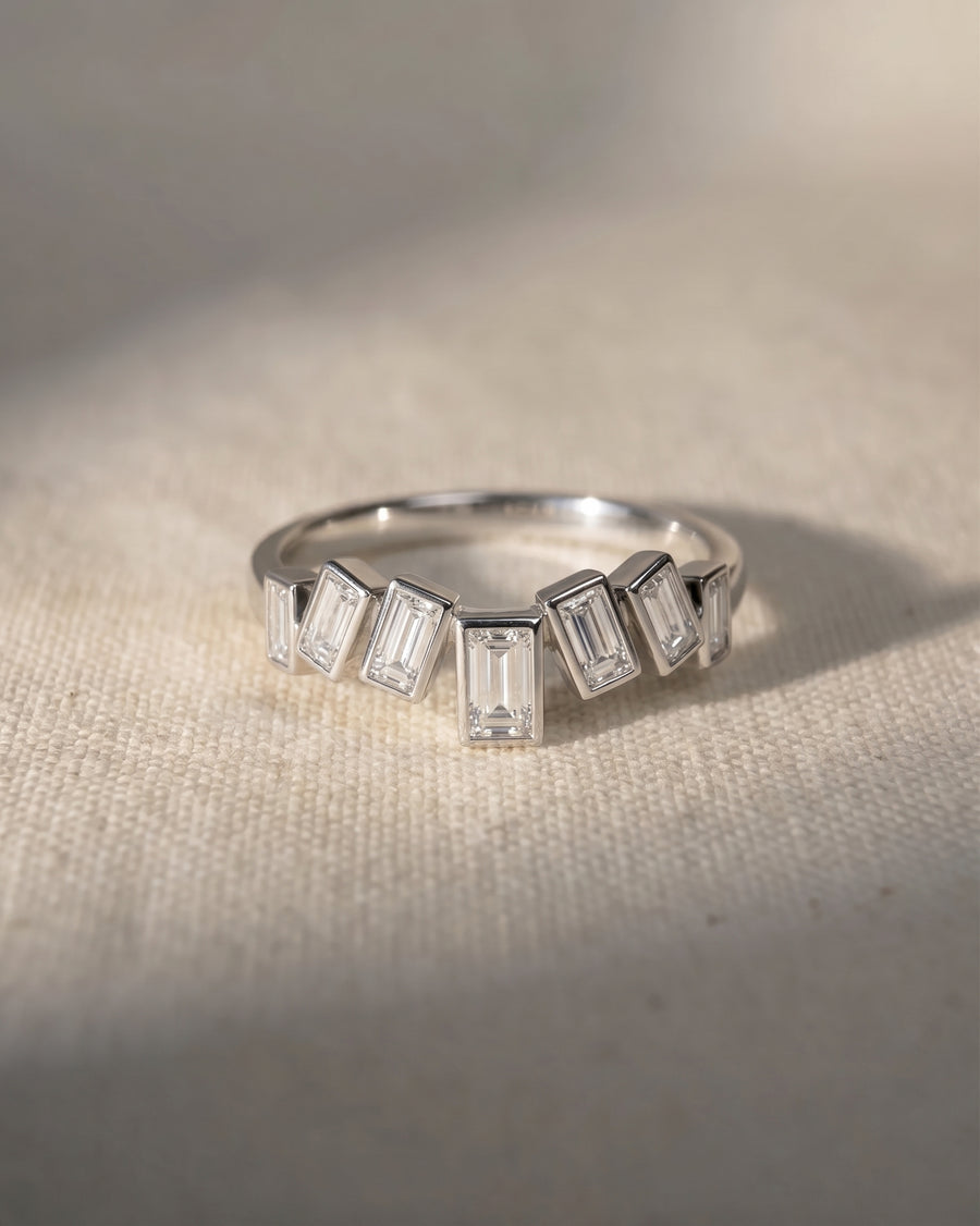 9ct white gold curved ring with baguette diamonds.