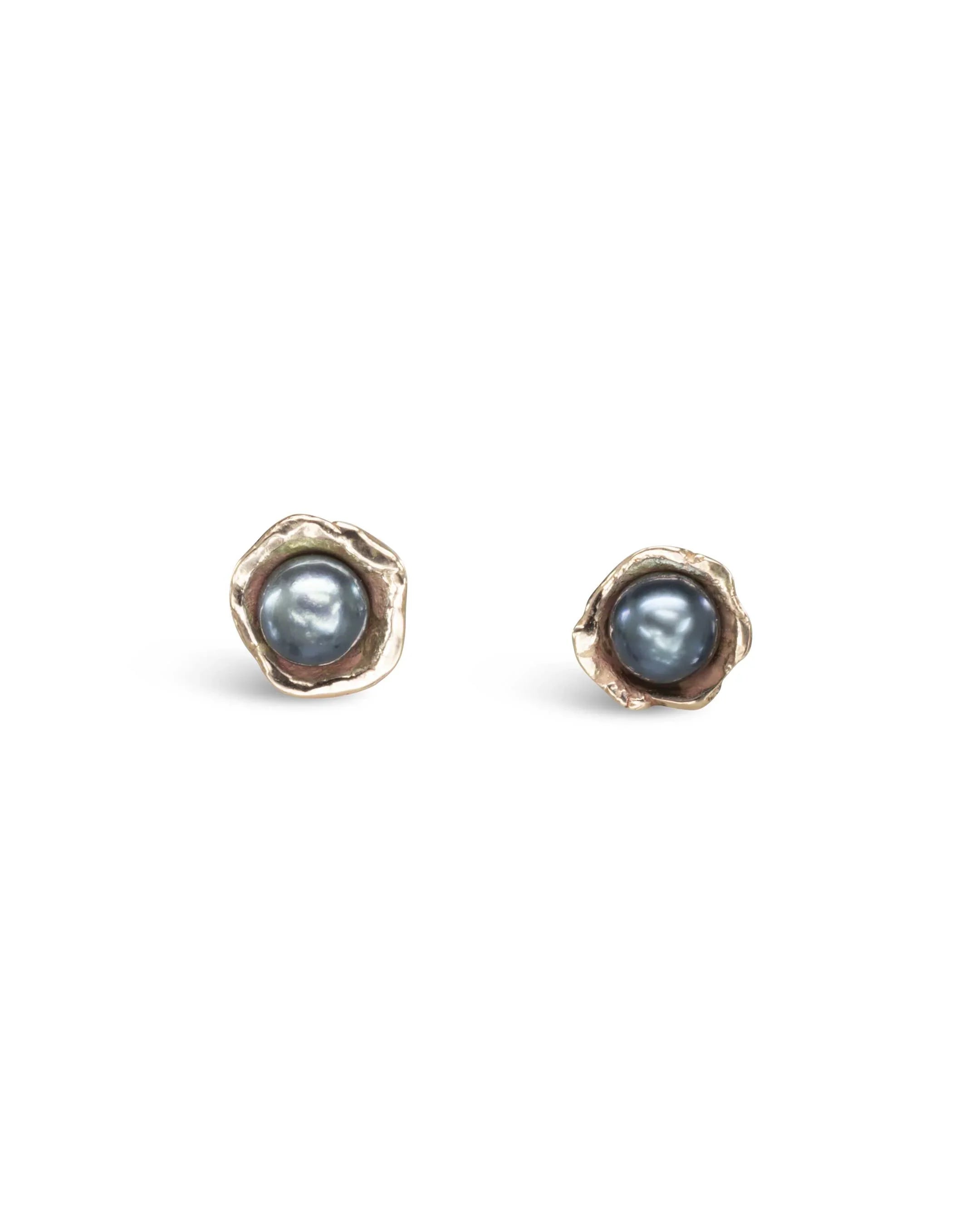 Black pearl ear studs with rugged edge silver setting and organic handmade style