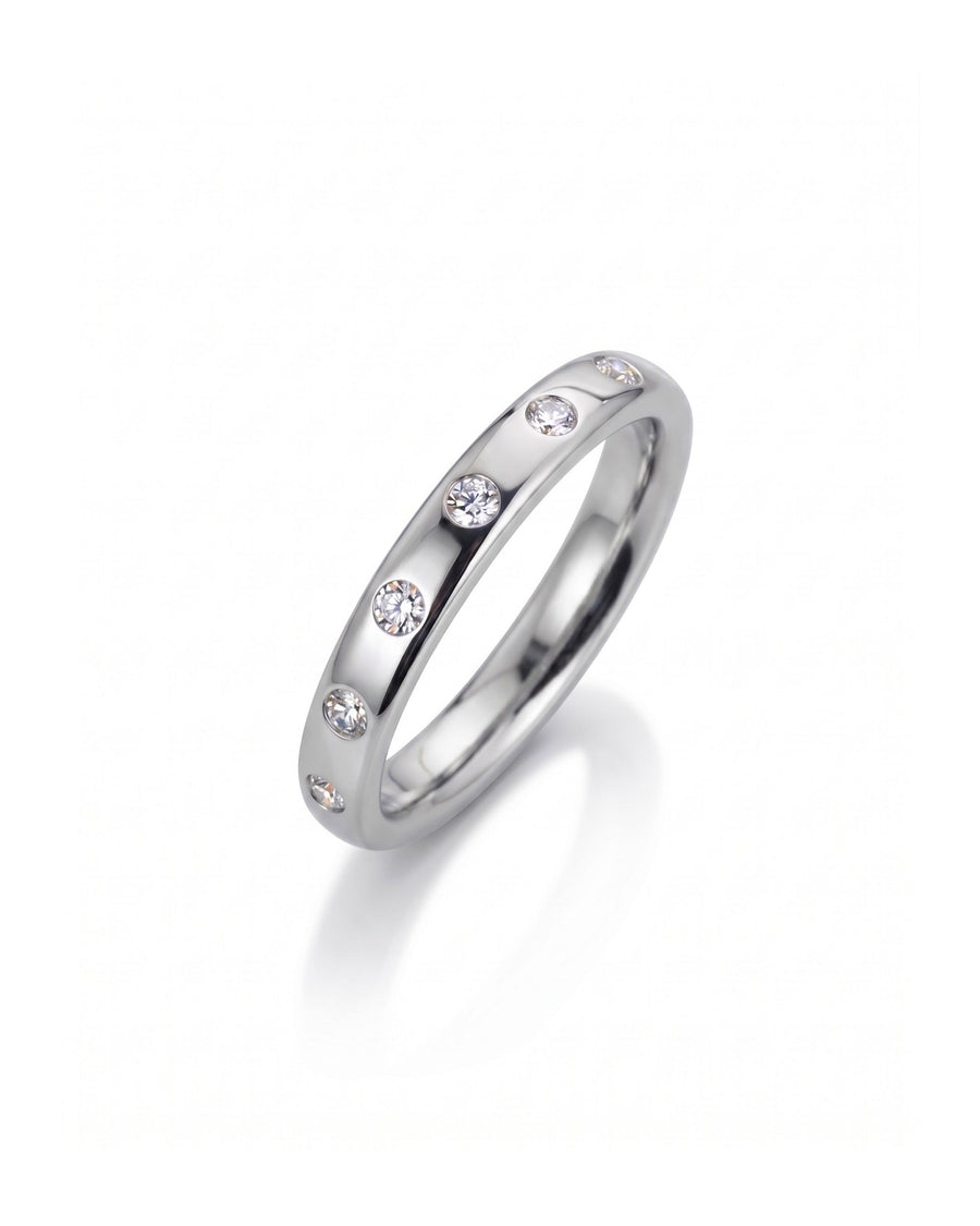 Platinum wedding ring with flush set diamonds.