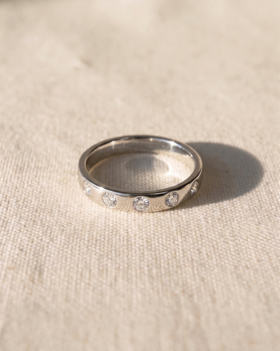 9ct white gold wedding ring with flush set diamonds.