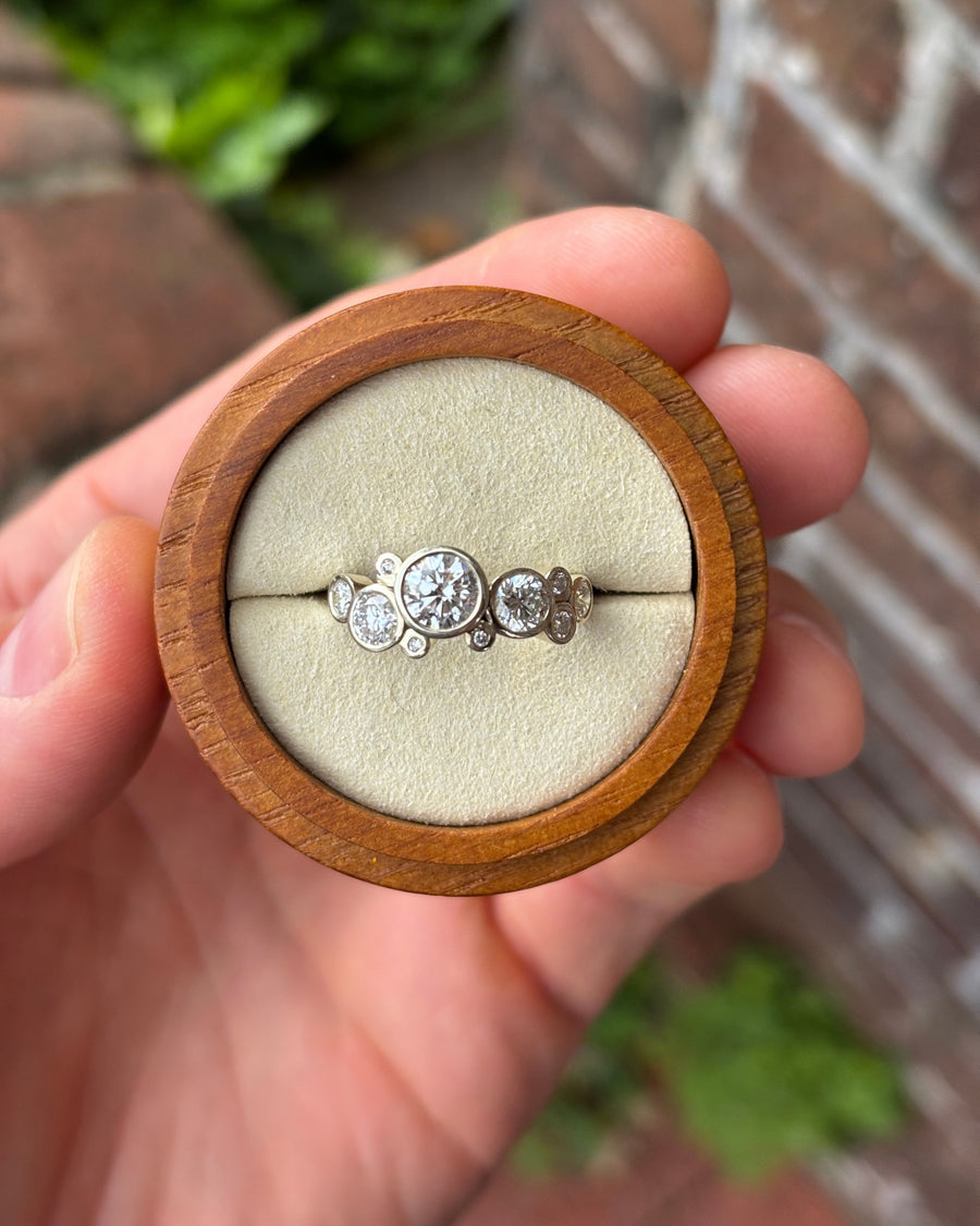 9ct white gold engagement ring with multiple round cut lab-grown diamonds in a bubble cluster design.