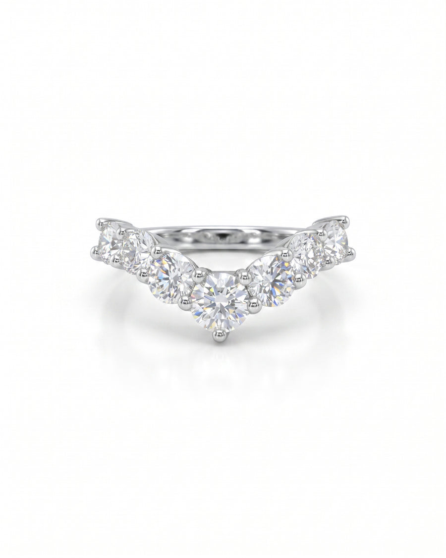 Silver wishbone fitted ring with seven round diamonds.