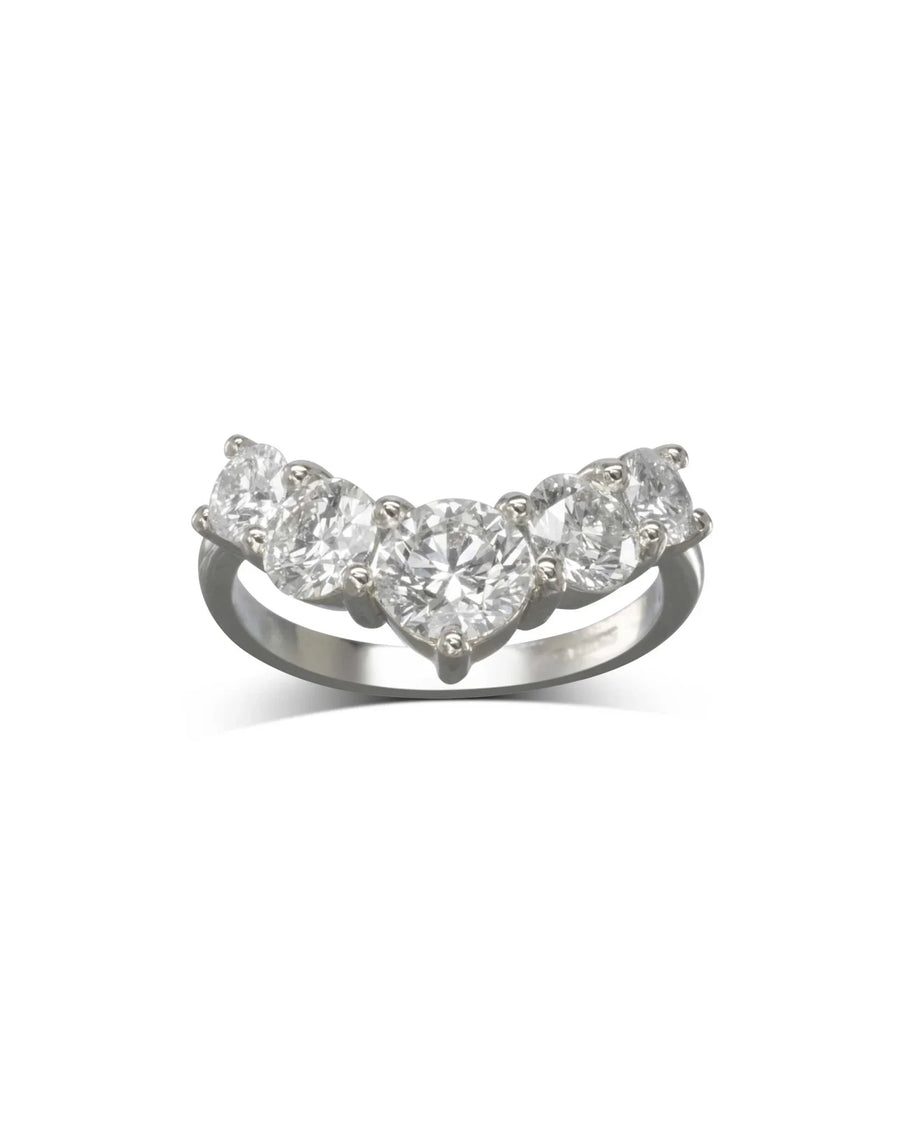 Silver wishbone ring with five heart-shaped diamonds.