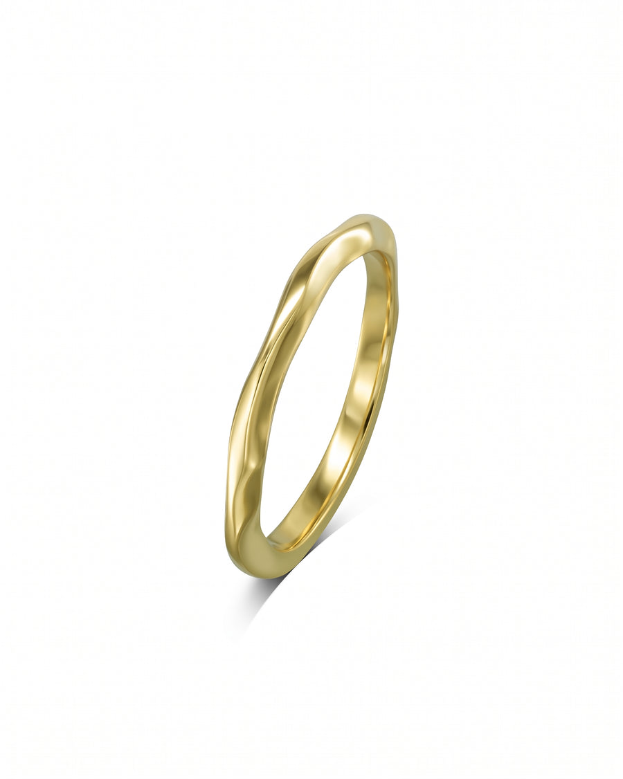 Gold dainty uneven wedding ring.
