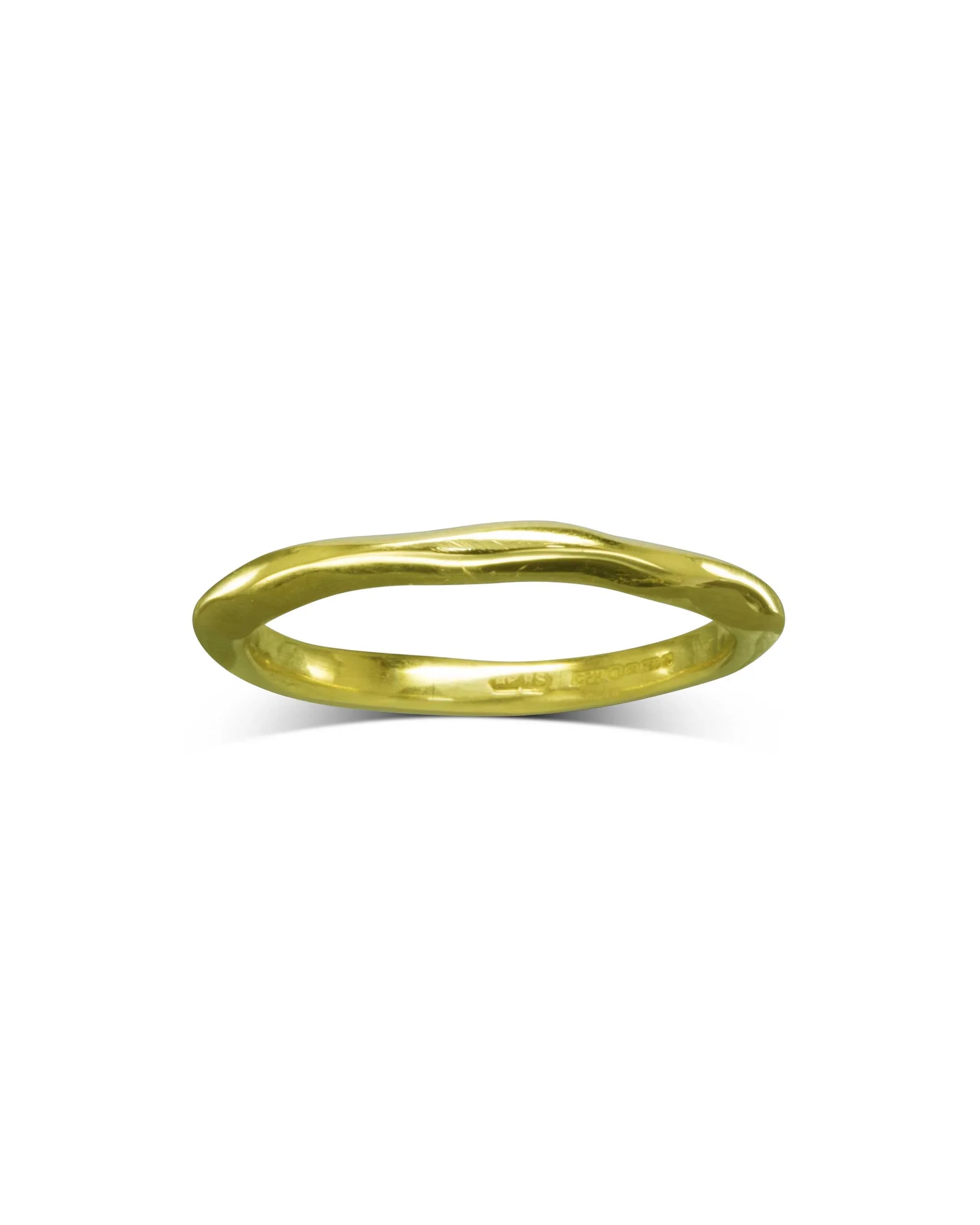 Gold dainty uneven wedding ring.
