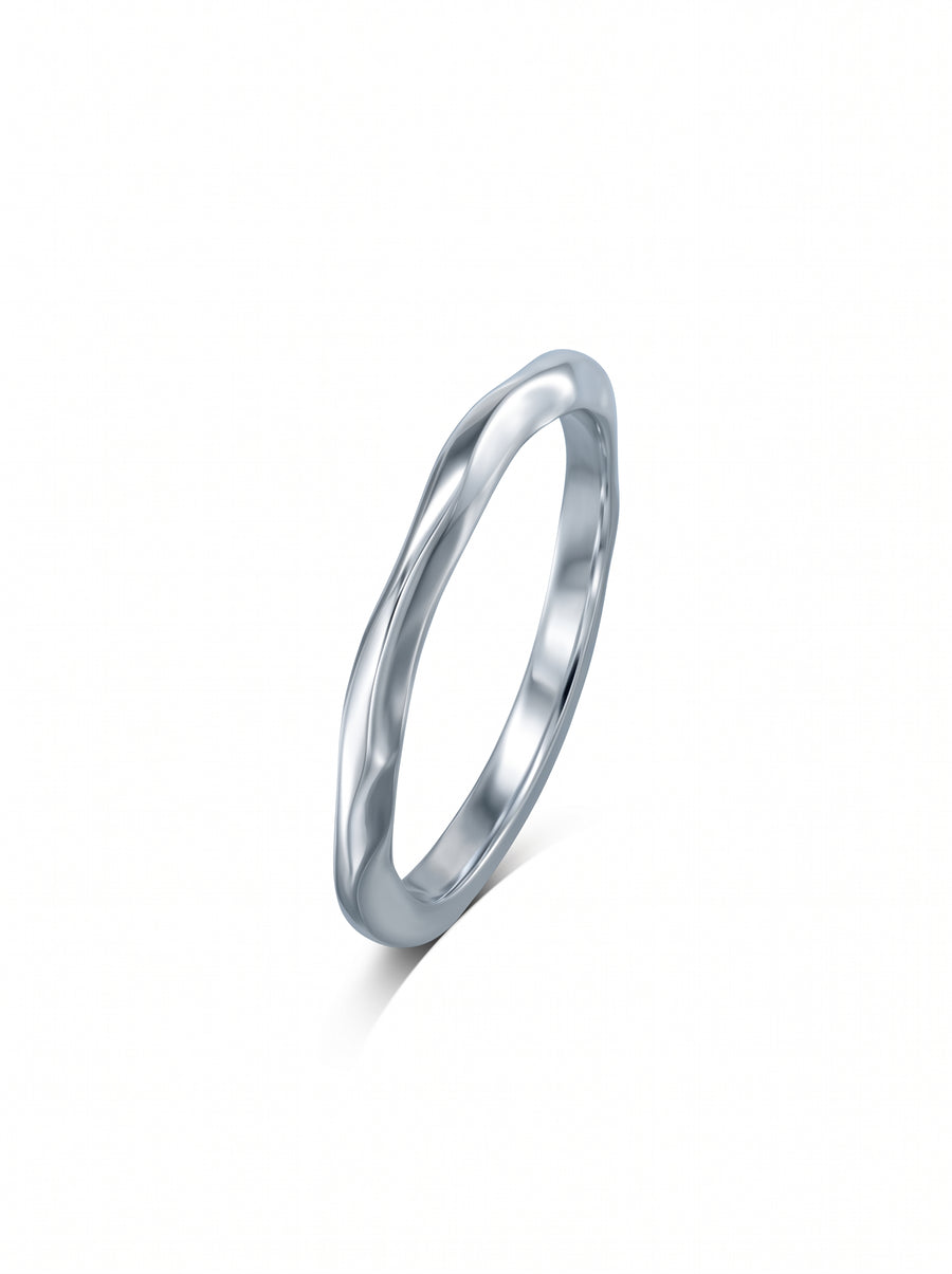 Dainty silver wedding ring with a smooth, uneven organic wave design.