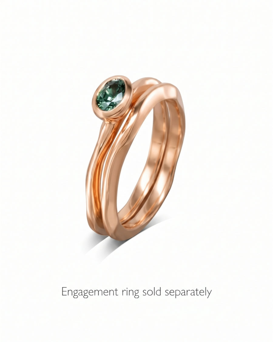 9ct rose gold wedding ring with a 2mm uneven, wavy band design.