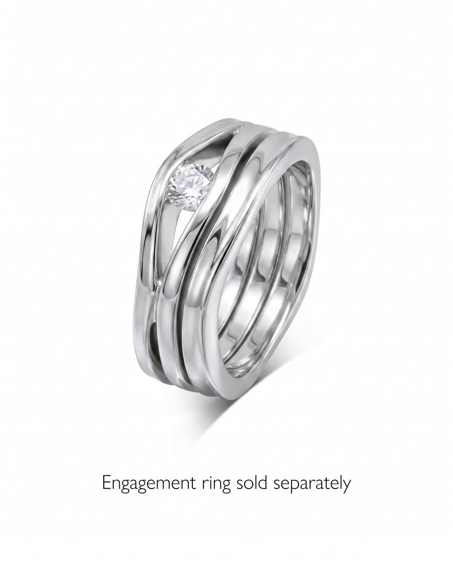Silver-toned wedding ring with a single round diamond in a wavy, layered design.