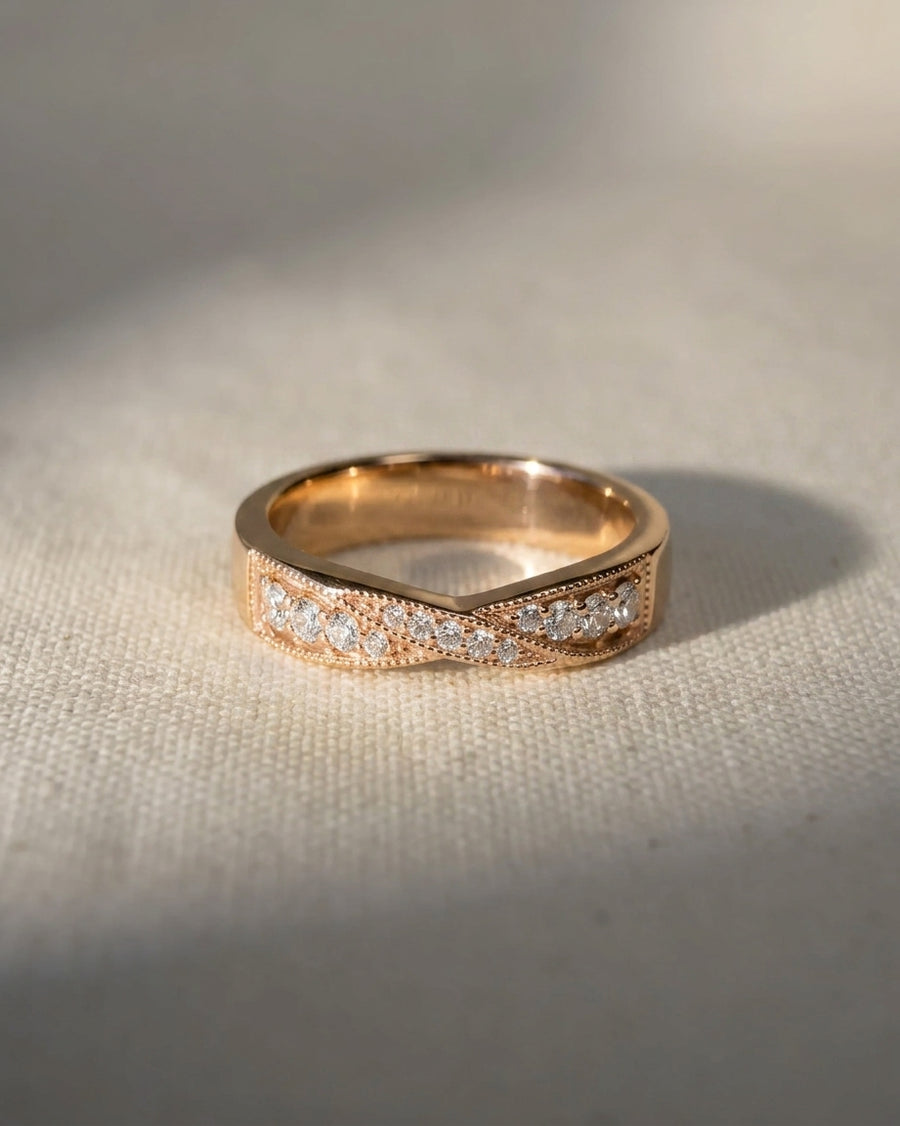 9ct rose gold vintage twist diamond ring with small round diamonds.