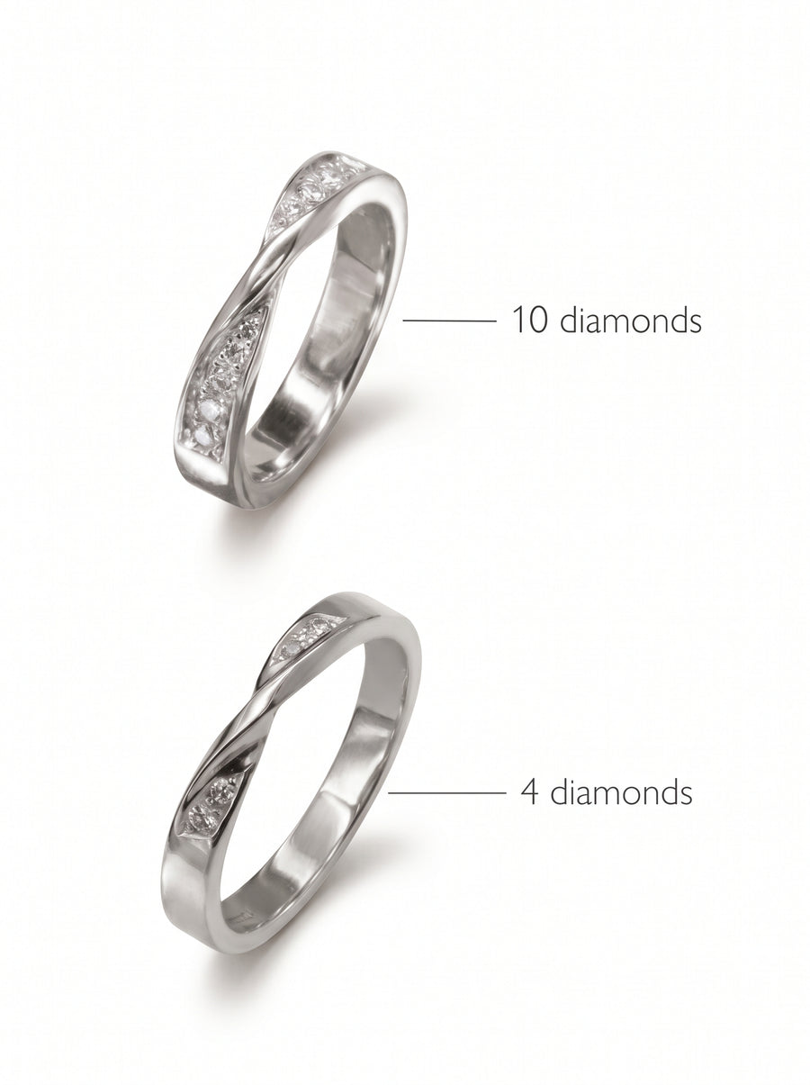 Two silver wedding rings with a twisted design, featuring either ten or four small round diamonds.