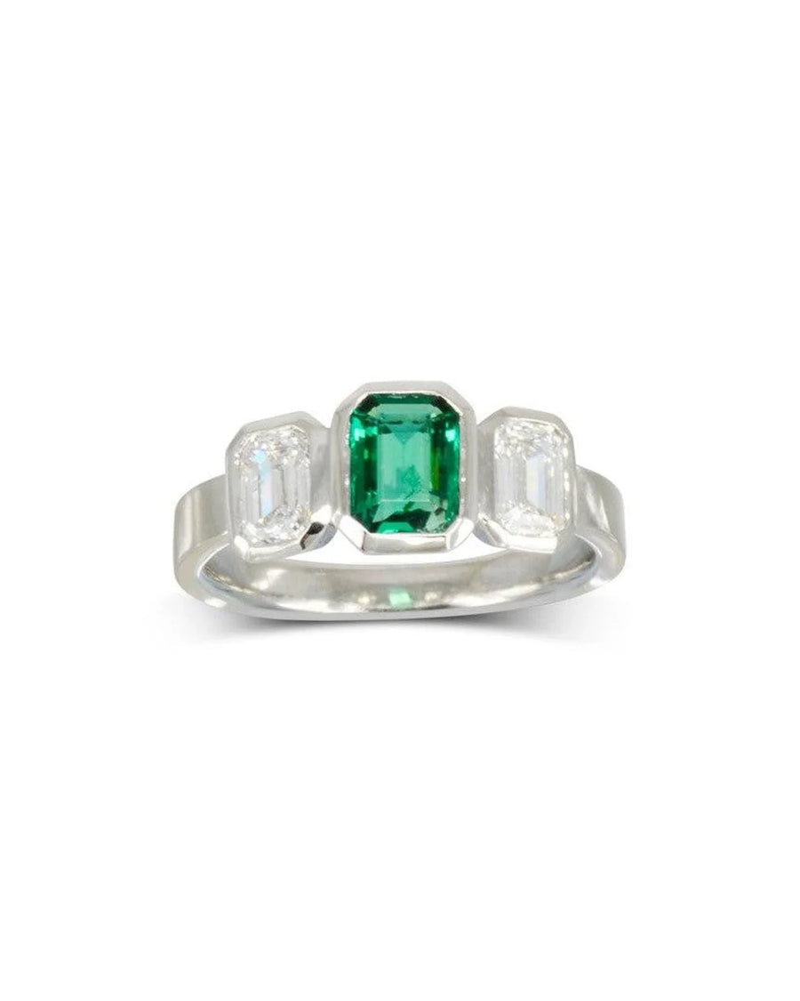 Platinum emerald and diamond trilogy ring.