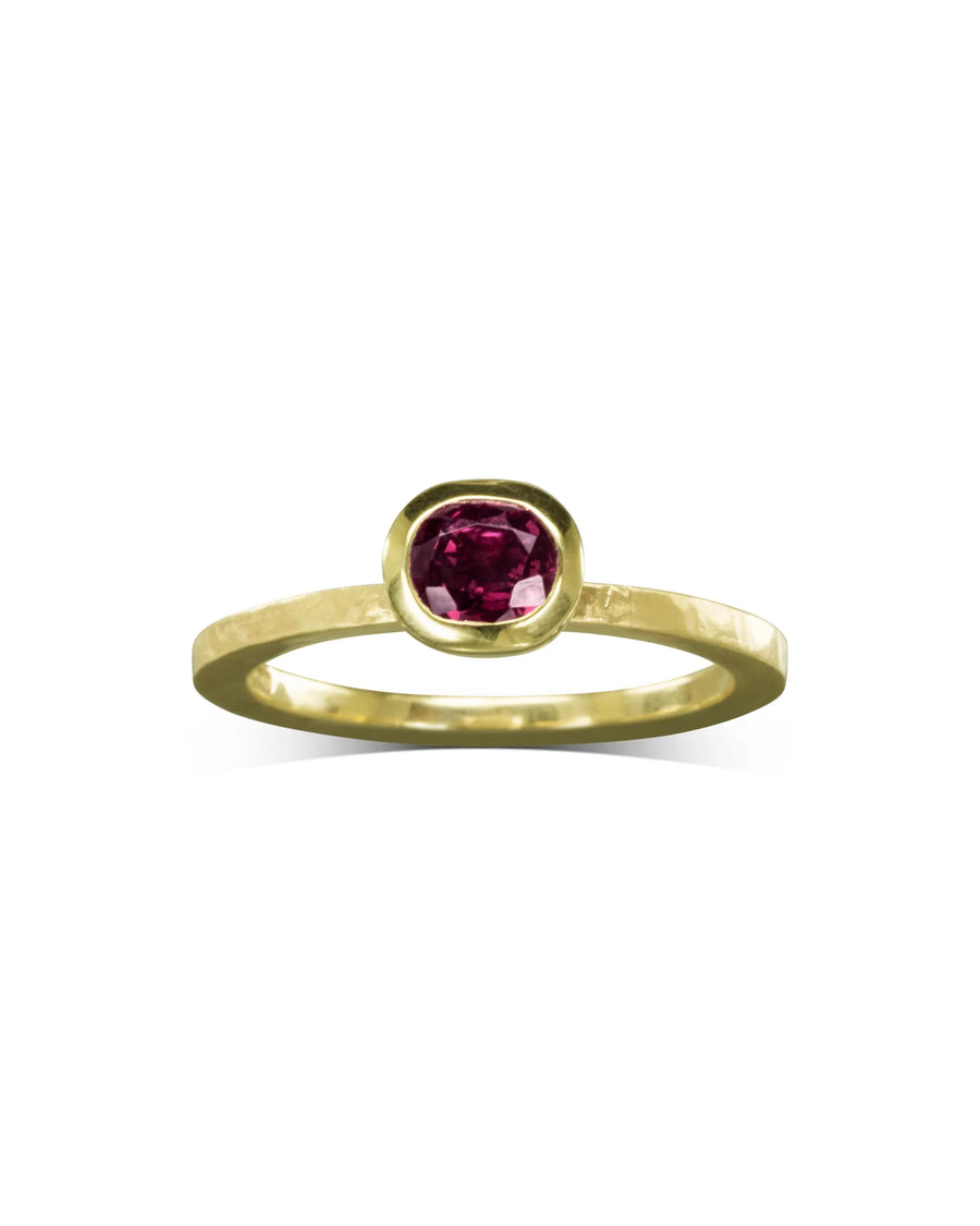 Handcrafted gold ring with bezel-set oval ruby, organic shape, luxury jewellery UK