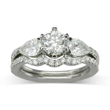 Claw Round and Pear Shaped Diamond Trilogy Ring Ring Pruden and Smith Engagement Ring with one fitted band  
