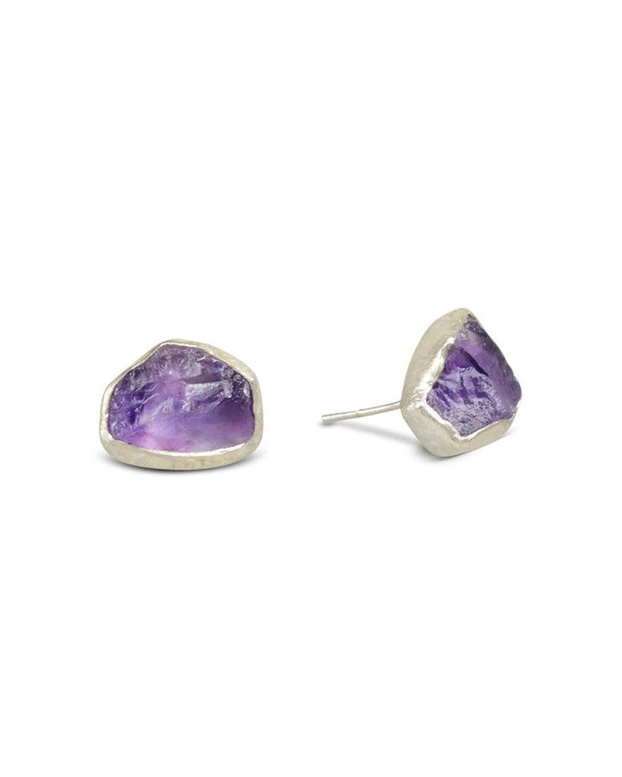 Silver stud earrings with rough cut purple amethyst gemstones.