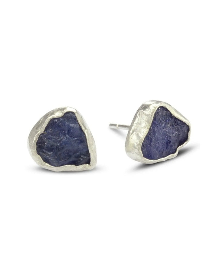 Silver stud earrings with rough cut dark blue gemstones.