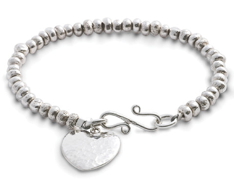 Silver nugget bracelet with hammered heart charm